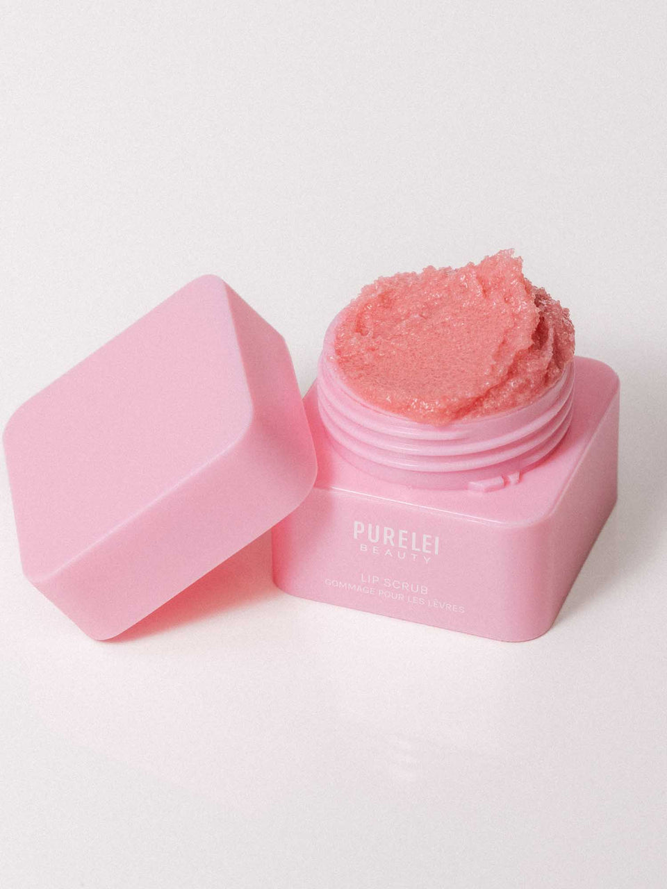 PURELEI Lip Scrub in zartem Rosa, sanftes Zuckerpeeling für geschmeidige Lippen, elegante Pflege für strahlende Natürlichkeit.