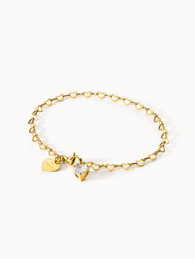 Goldenes Armband mit Herzdesign und Kristallanhänger von PURELEI.