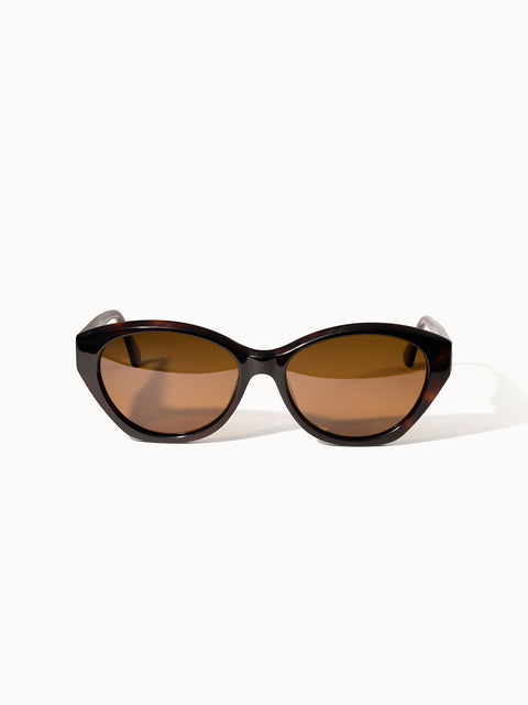Lagoon Sonnenbrille von PURELEI in dunkelbraunem Acetat mit ovalem Rahmen und goldenen Details, vintage-inspiriert.