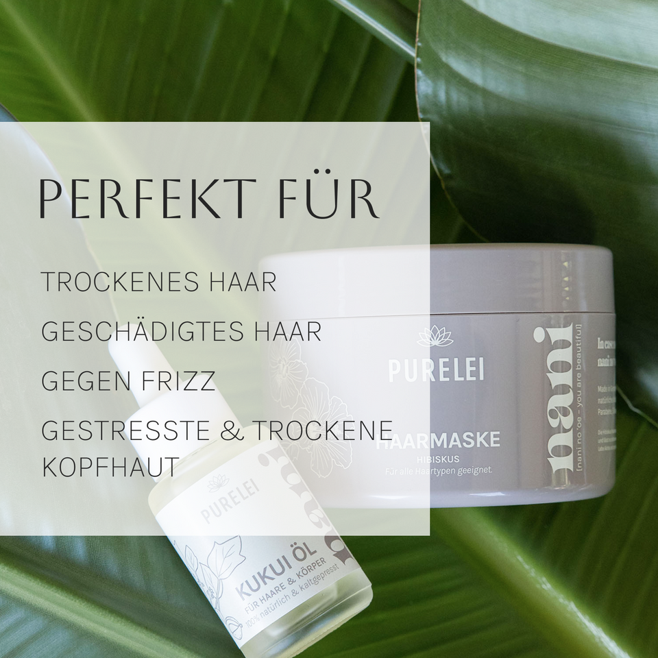 PURELEI Hawaiian Gloss Haircare Set mit Hibiskus Haarmaske und Kukui Öl vor grünem Blätterhintergrund.
