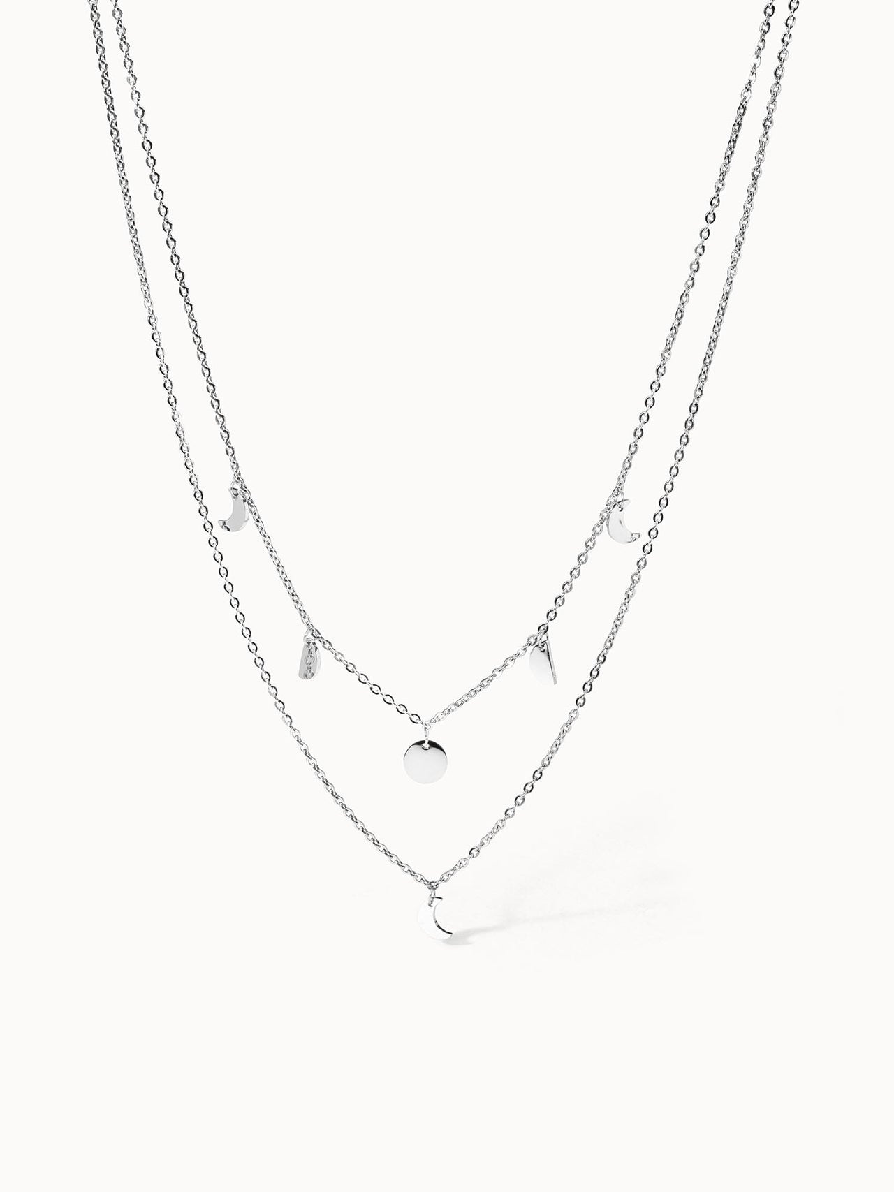 PURELEI Luna Kette aus silberfarbenem Edelstahl mit filigranen Mond-Anhängern, elegant und zeitlos.