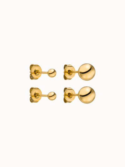 Goldene Ohrringe mit glänzenden Kugeldesigns von PURELEI, elegant und modern.