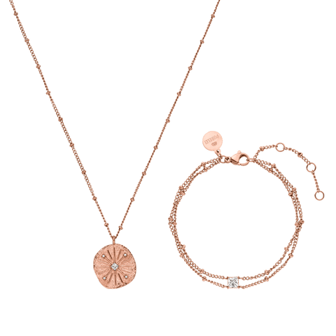 Roségoldene Kette und Armband mit funkelndem Anhänger von PURELEI, elegant und feminin.
