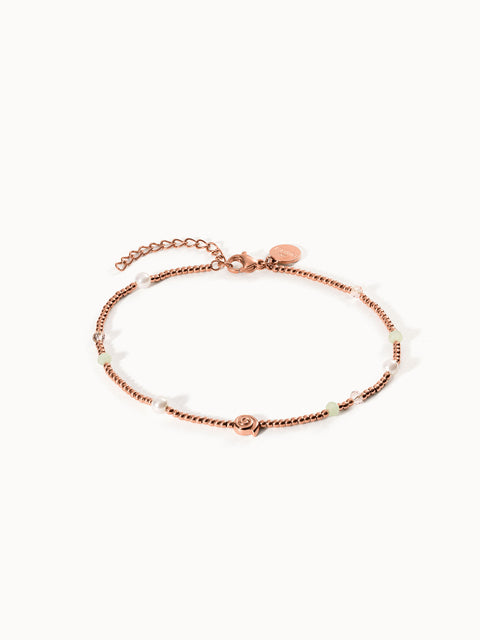 Roségoldenes Armband mit Perlen und zarten Details von PURELEI, elegant und feminin.