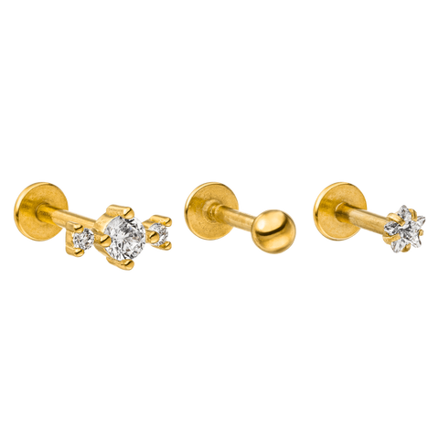 Goldene Ohrringe mit funkelnden Steinen von PURELEI, elegant und modern.